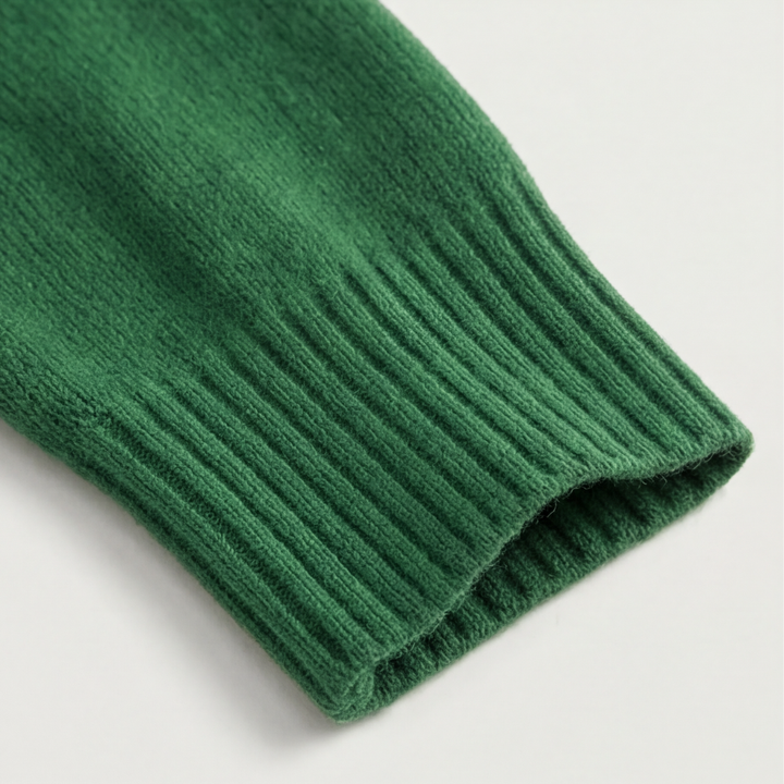 Adalyn asymmetric collar knit sweater, worn at a cafe table
