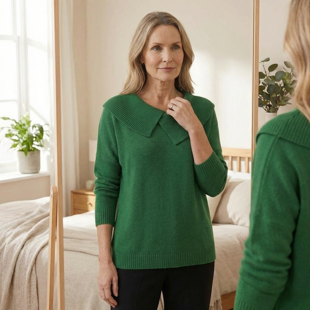 Adalyn asymmetric collar knit sweater, worn indoors by mirror