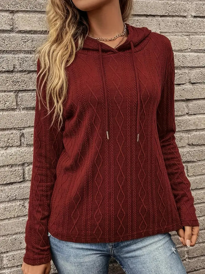 Adeline hoodie close-up showing cable knit texture and drawstring details