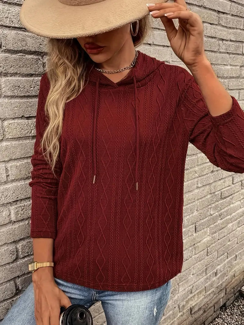 Adeline hoodie styled with jeans and coffee cup, front view