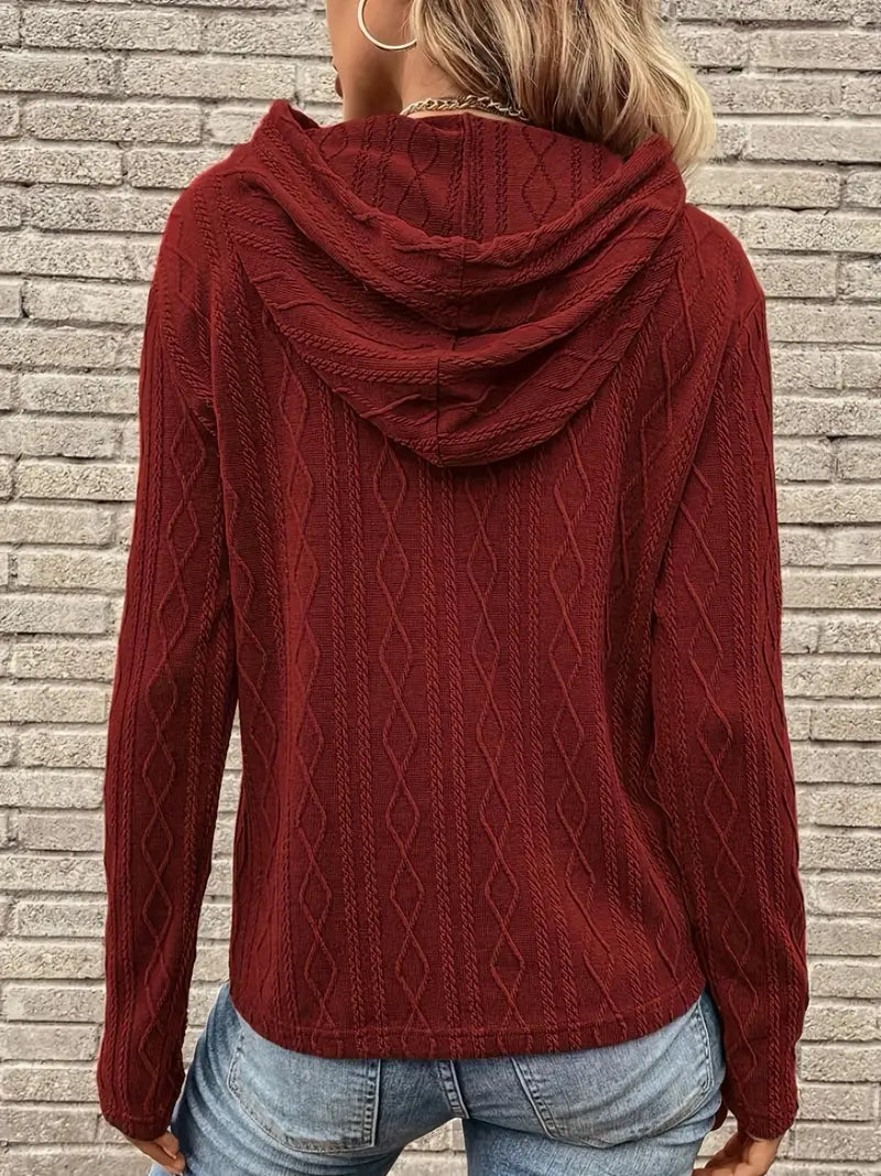 Adeline cable knit hoodie worn with hat, front view