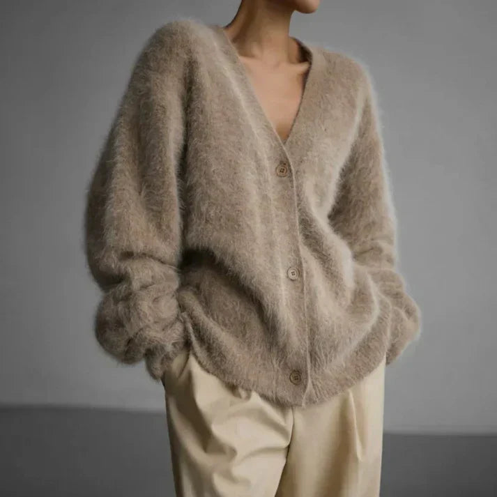 Adeline fuzzy oversized cardigan in beige, front view with hands in pockets