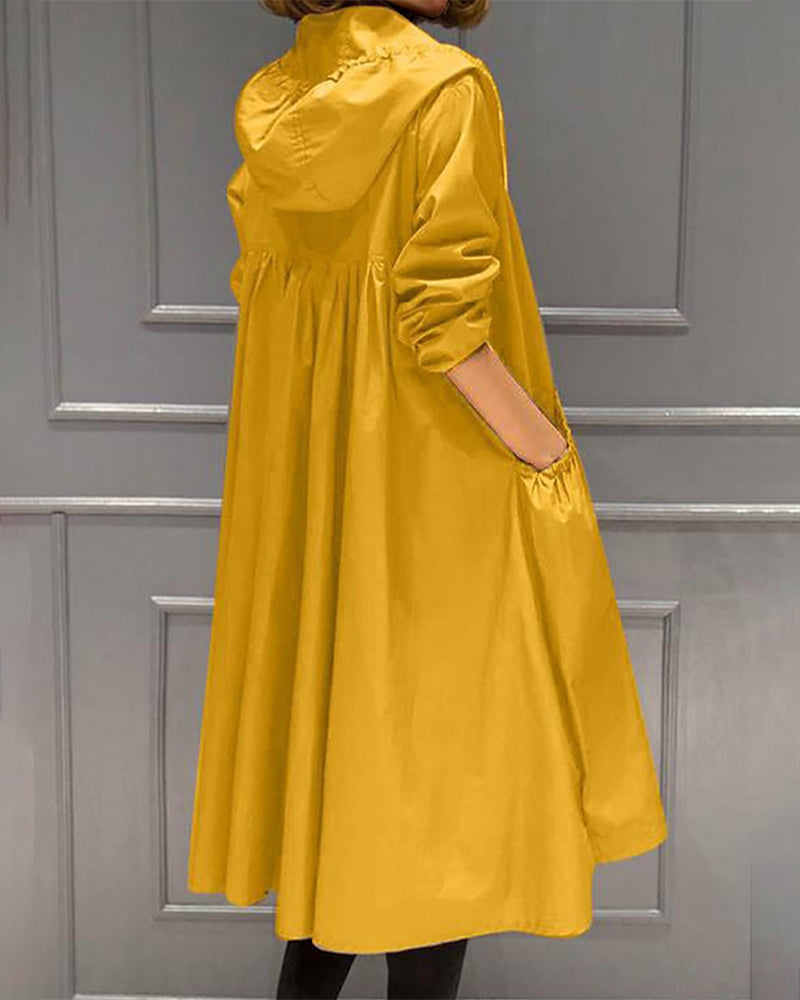 Adeline hooded trench coat, back view showing pleated silhouette