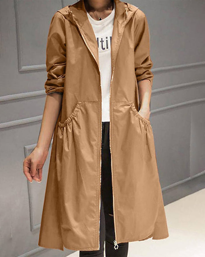 Adeline hooded trench coat, front view with hand in pocket