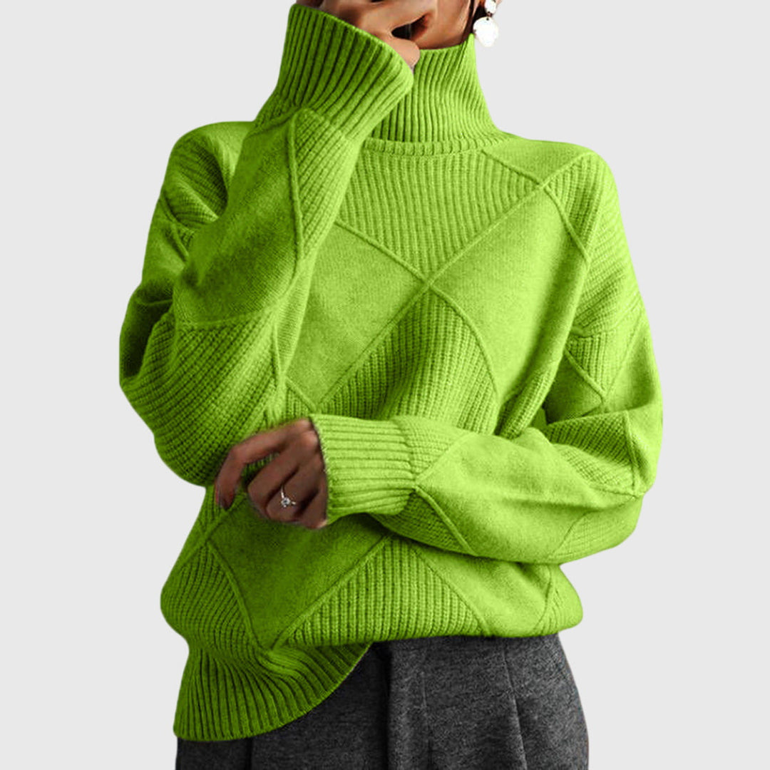 Model wearing lime green oversized turtleneck sweater with arms crossed, front view