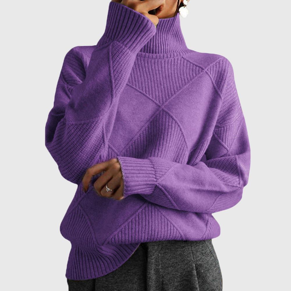 Model wearing purple oversized turtleneck sweater with arms crossed, front view