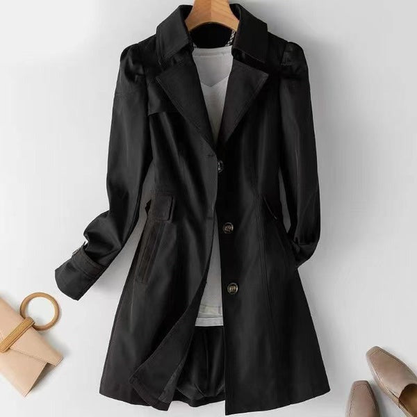 Adeline single-breasted trench coat in black, front view on hanger