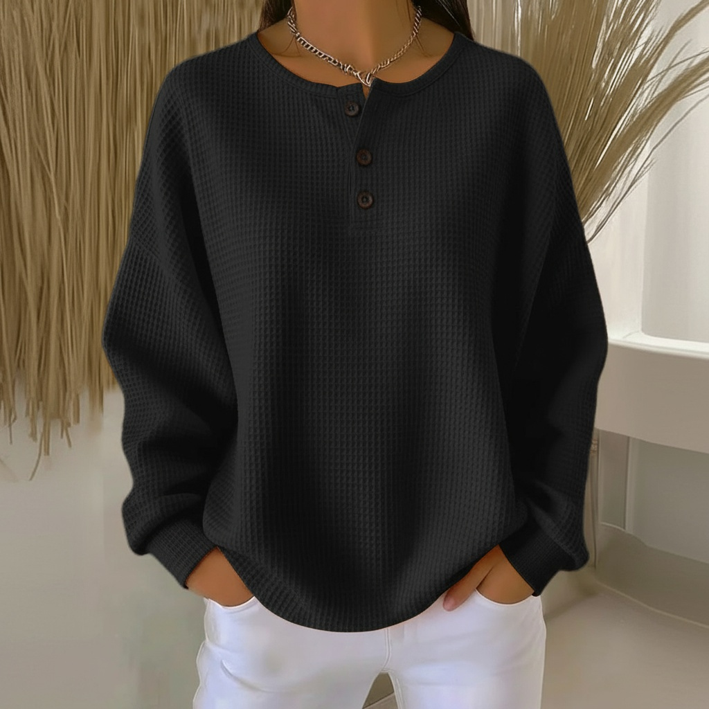 Adeline waffle knit henley sweater in black, front view