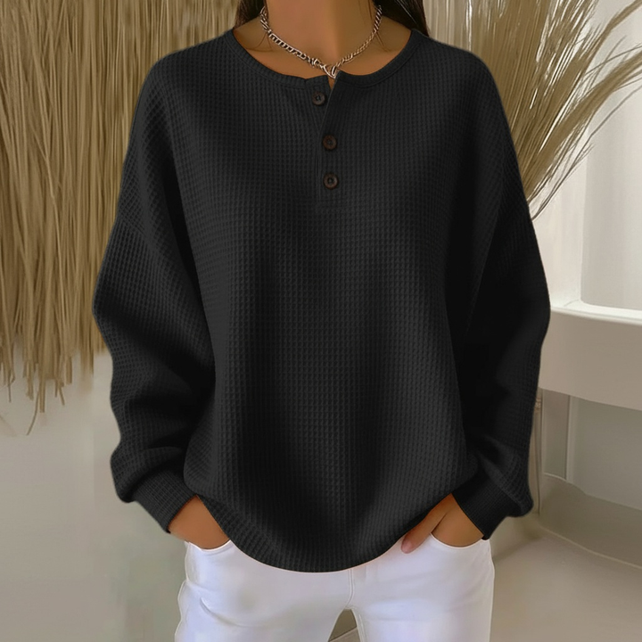 Adeline waffle knit henley sweater in black, front view