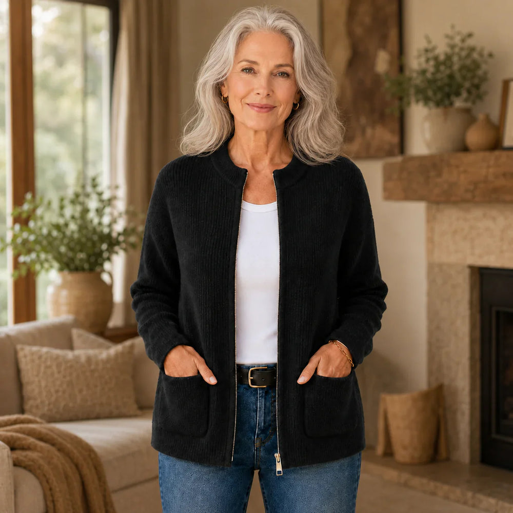 Black ribbed knit zip-up cardigan styled with jeans, front view
