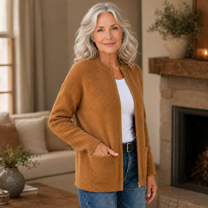 Camel ribbed knit zip-up cardigan, side view with hand in pocket