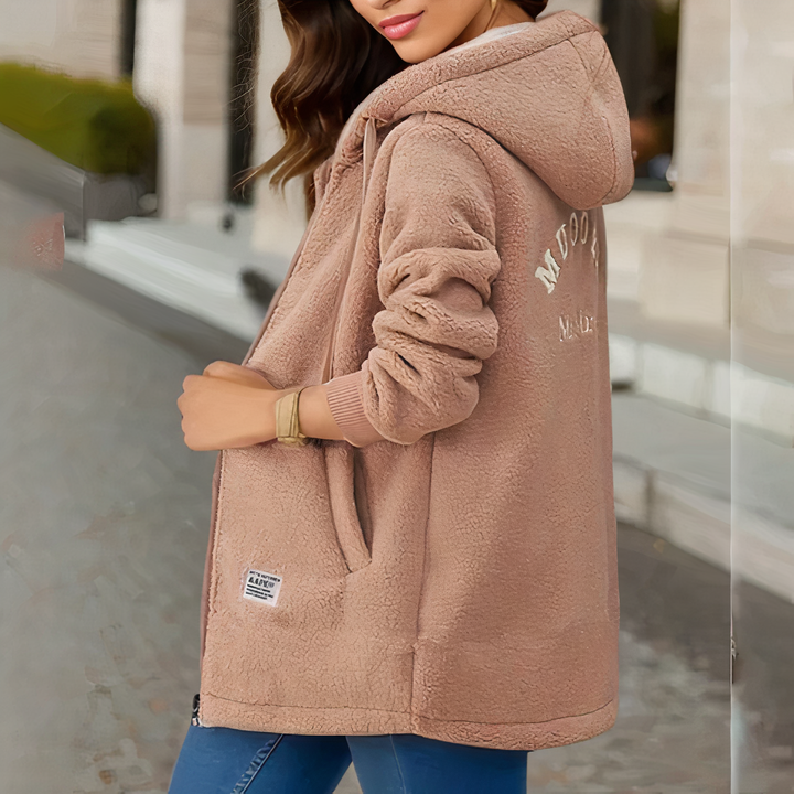 Amara neutral hooded sherpa longline jacket, side view with embroidered detail
