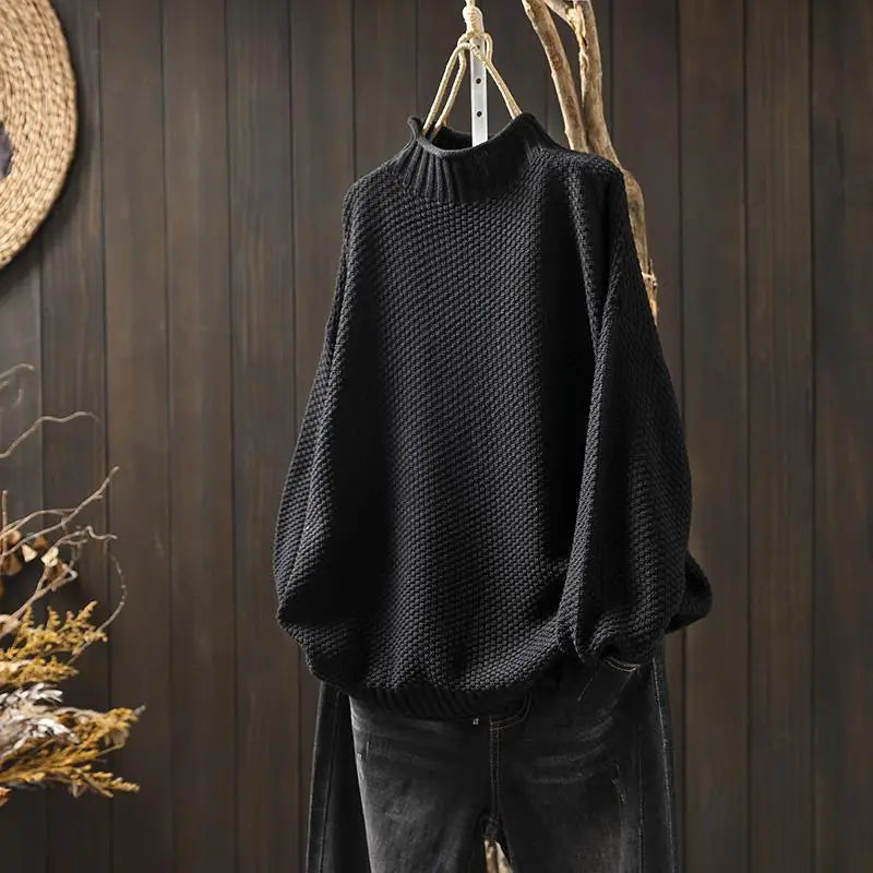 Amara oversized mock neck sweater in black, front view