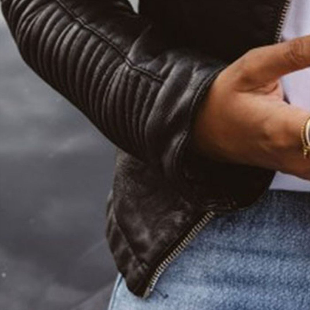 Close-up of ribbed quilted sleeve and zip cuff detail