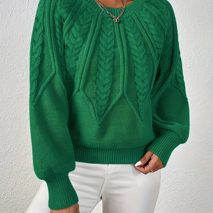 Astrid green cable-knit sweater, close-up front detail