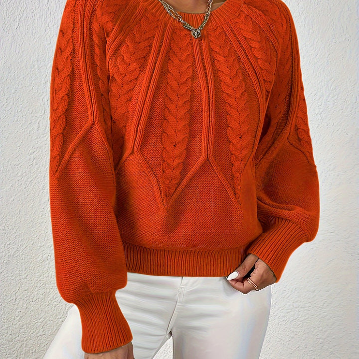 Astrid orange cable-knit sweater, close-up detail