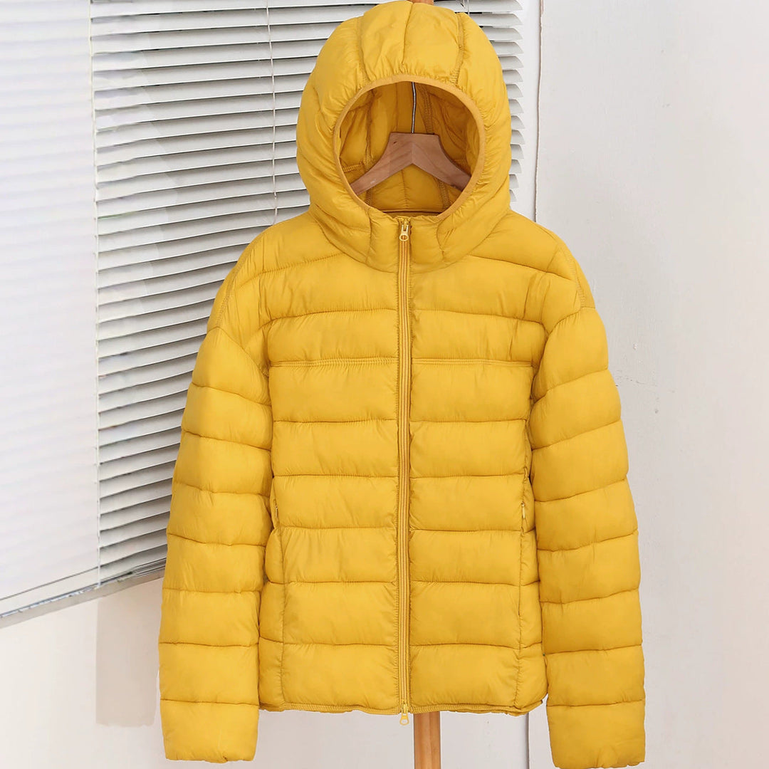 Bellamy yellow lightweight hooded puffer jacket, front view on hanger