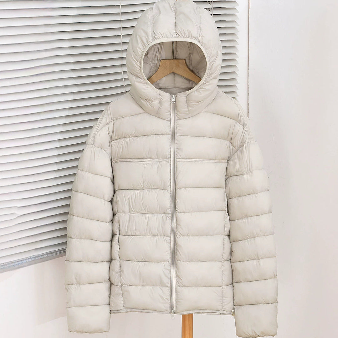 Bellamy ecru lightweight hooded puffer jacket, front view on hanger