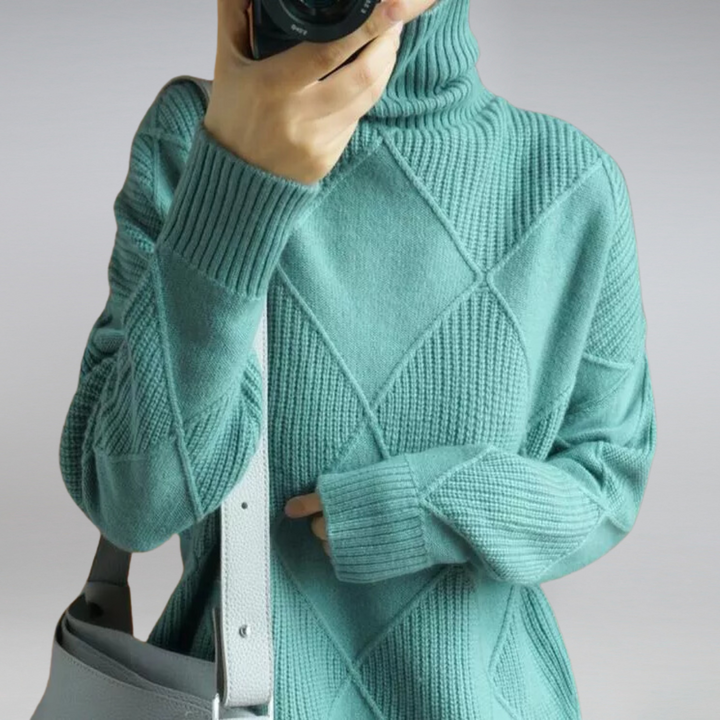 Teal turtleneck sweater with diamond knit pattern, close-up