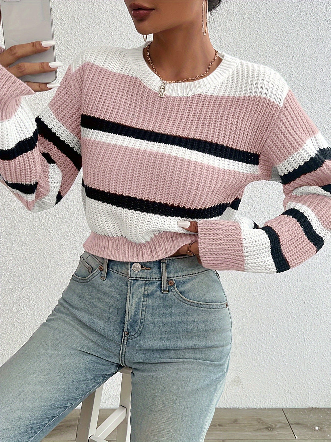 Delphine pink striped round-neck sweater, front view close-up