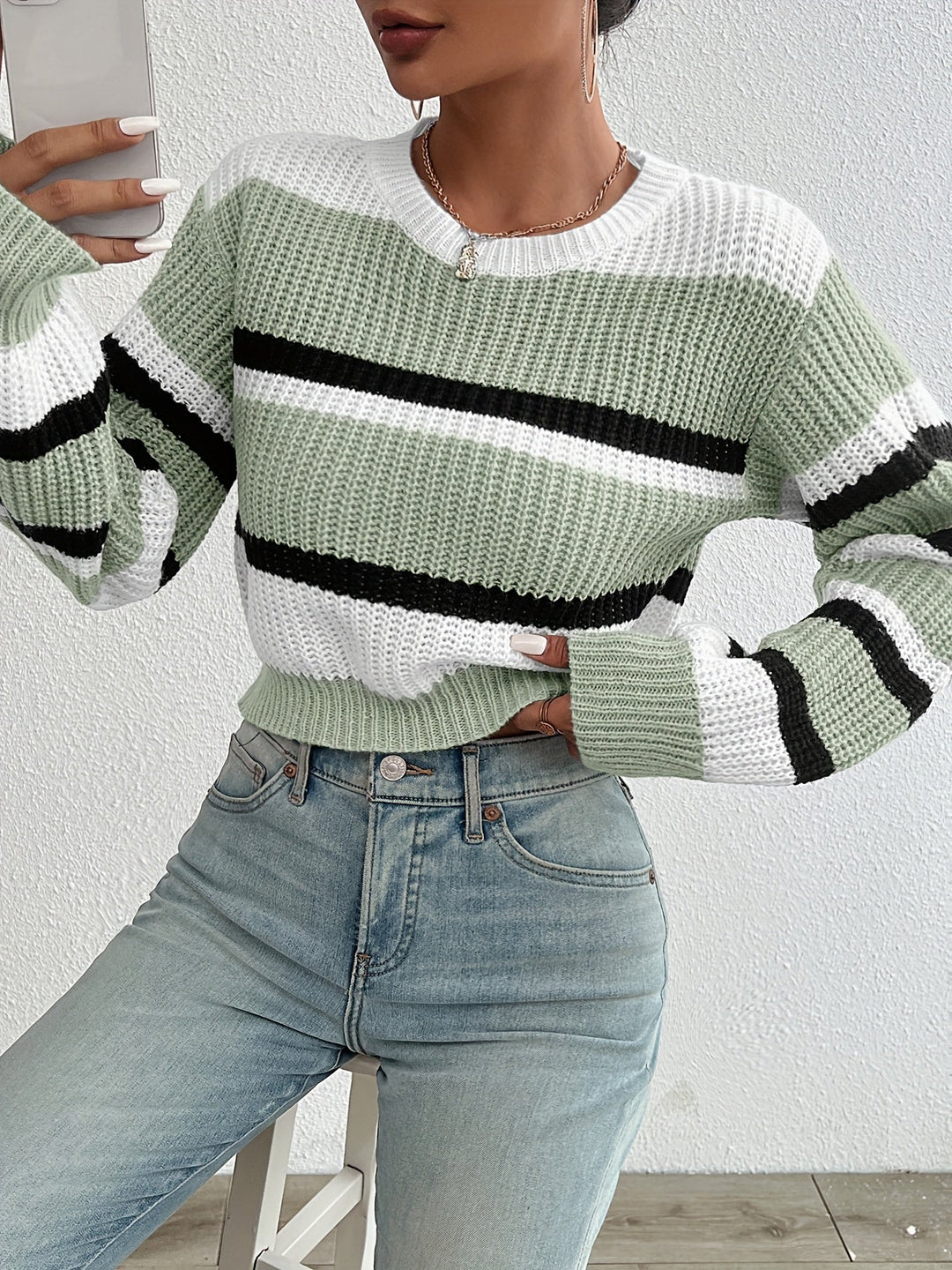 Delphine sage green striped round-neck sweater, front view close-up