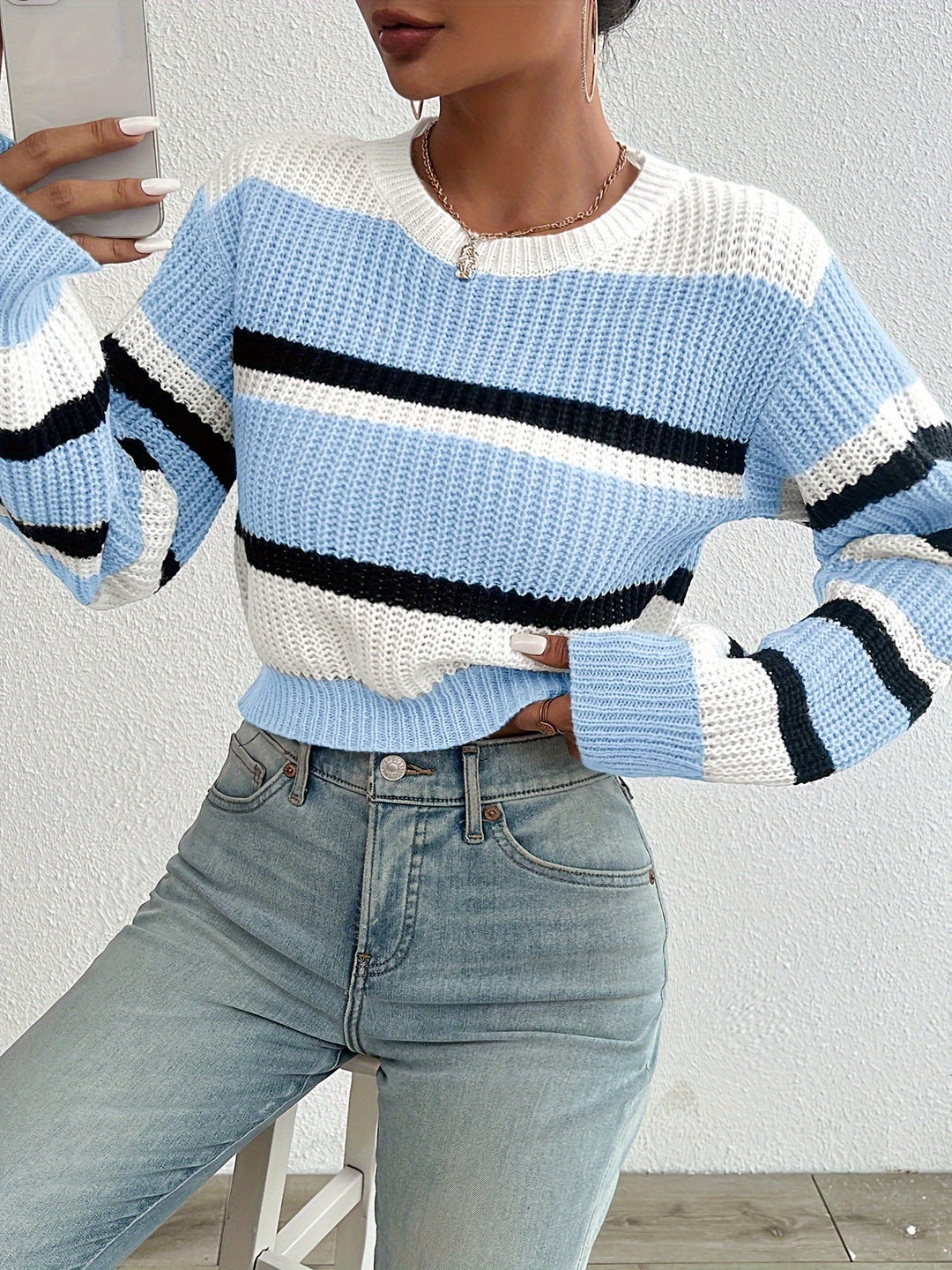 Delphine sky blue striped round-neck sweater, front view close-up