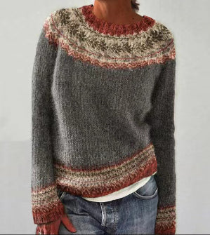 Gray fair isle sweater with rust patterned trim, close-up view