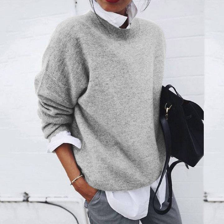 Gray oversized mock neck sweater on model, front view