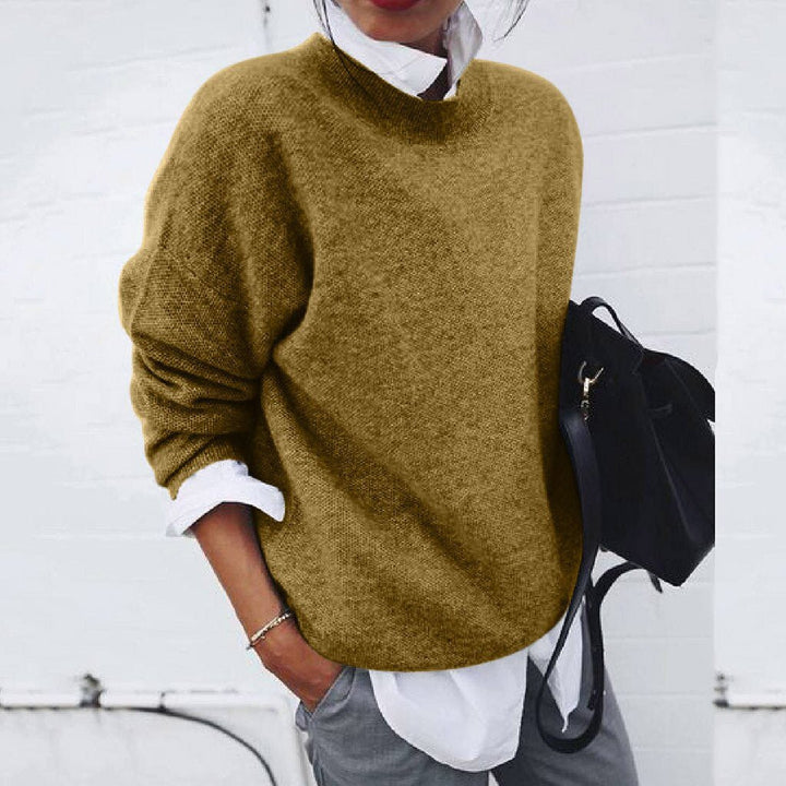 Olive oversized mock neck sweater on model, front view