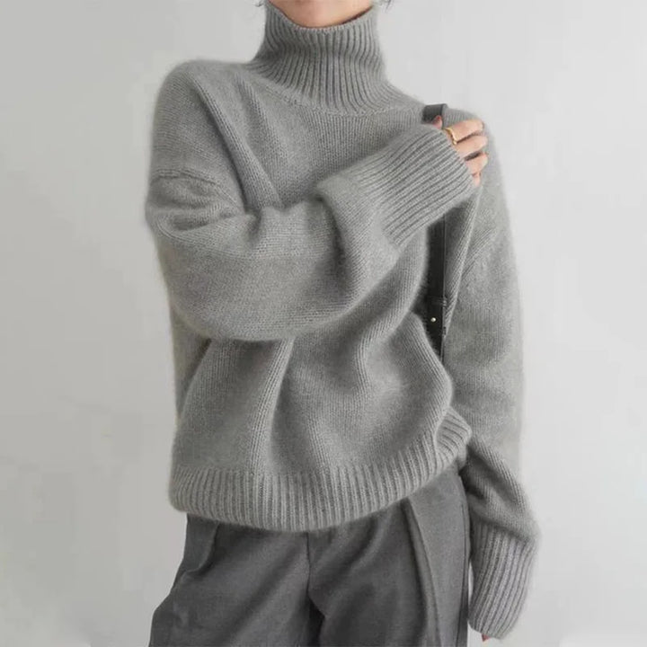 Elena turtleneck sweater in gray, side view with crossbody bag strap