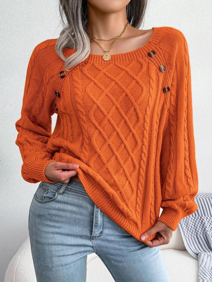 Everly cable knit sweater with square neck and button detail, front view in orange
