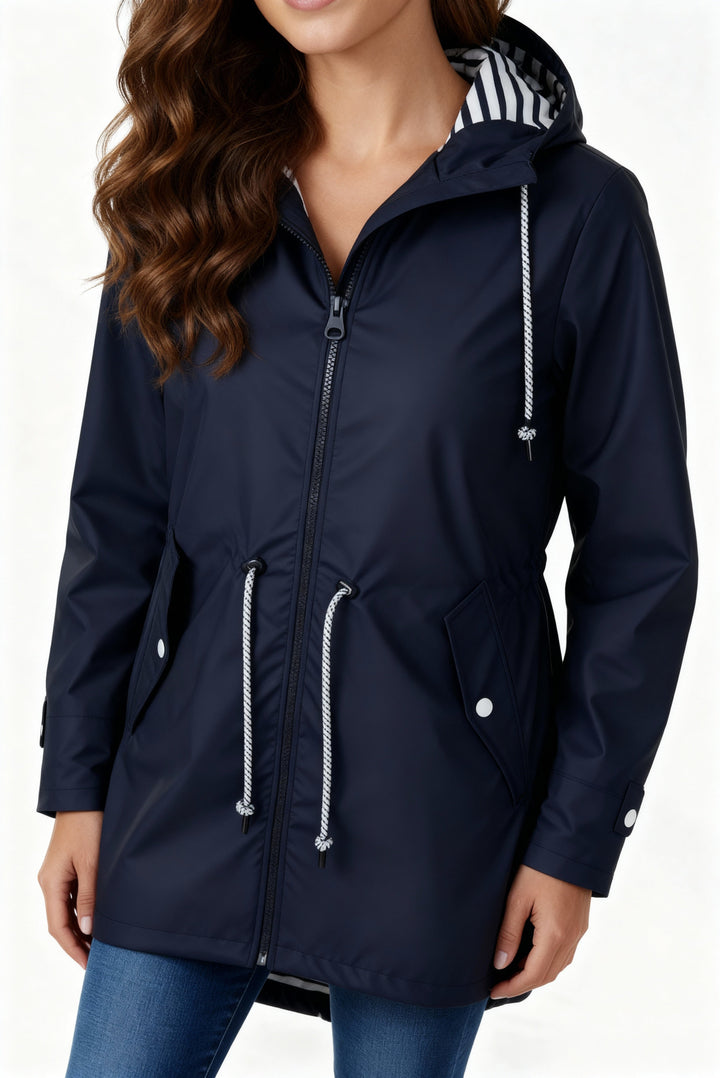 Close-up of Everly navy rain jacket zipper and drawstring waist detail
