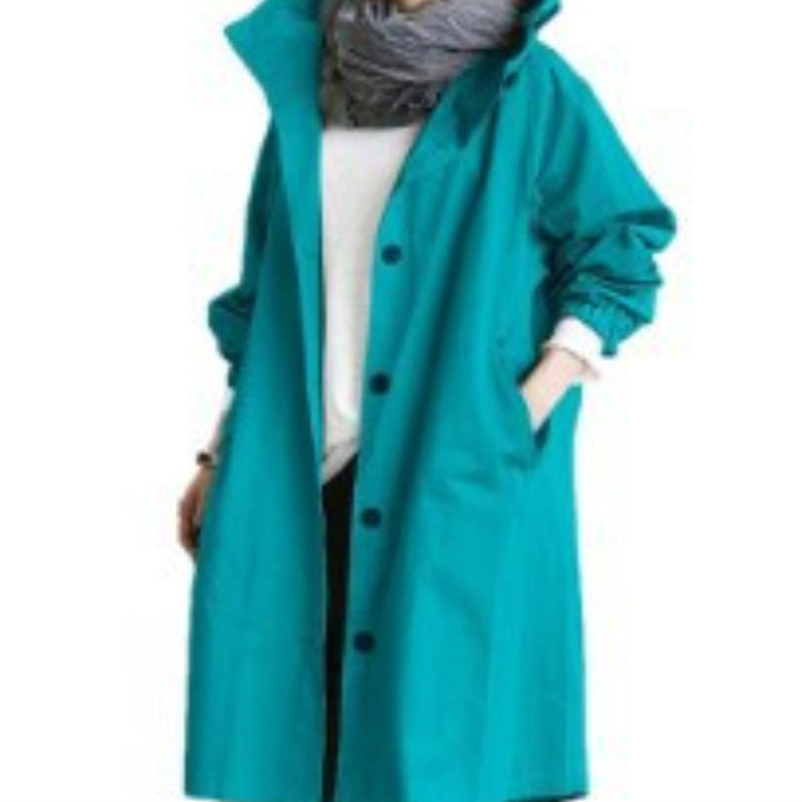 Everly hooded oversized trench coat in teal, close-up front view showing button closure