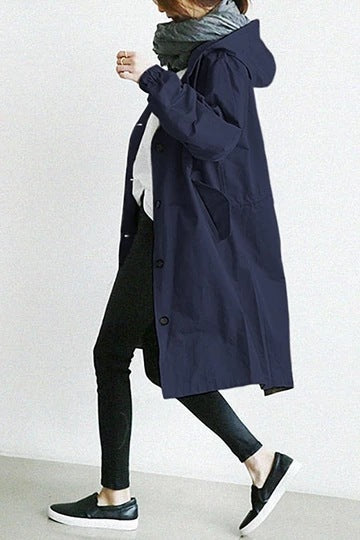 Everly hooded oversized trench coat in navy blue, side view walking