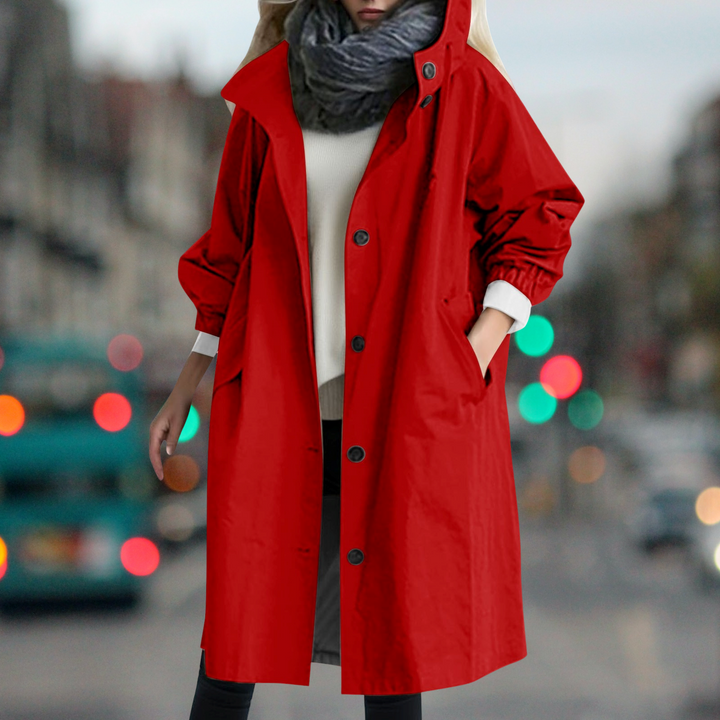 Everly hooded trench coat in red, front view with hand in pocket