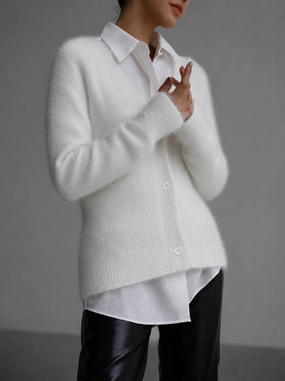 Everly oversized cardigan in white, layered over a collared shirt, front view