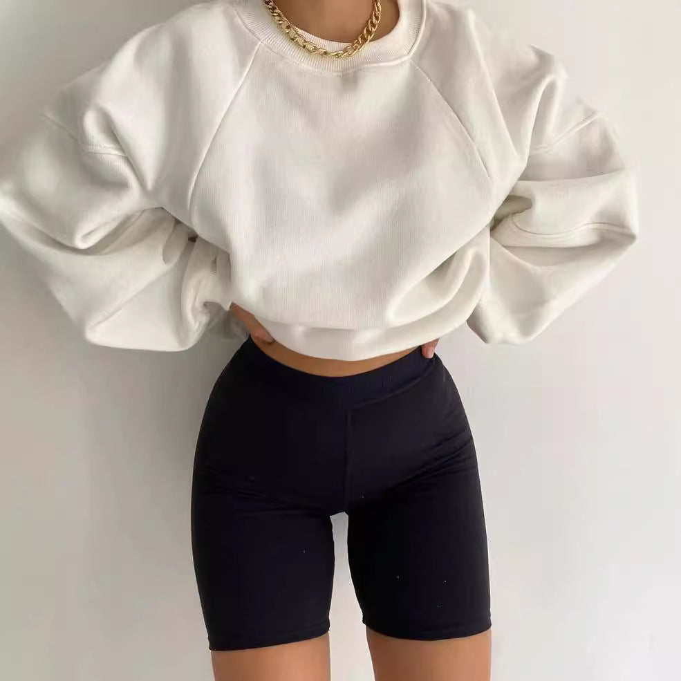 Frances oversized sweatshirt with voluminous balloon sleeves in white, styled with biker shorts