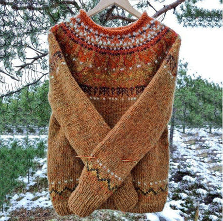 Freya Icelandic knit sweater in brown colorway hanging outdoors in a snowy pine setting