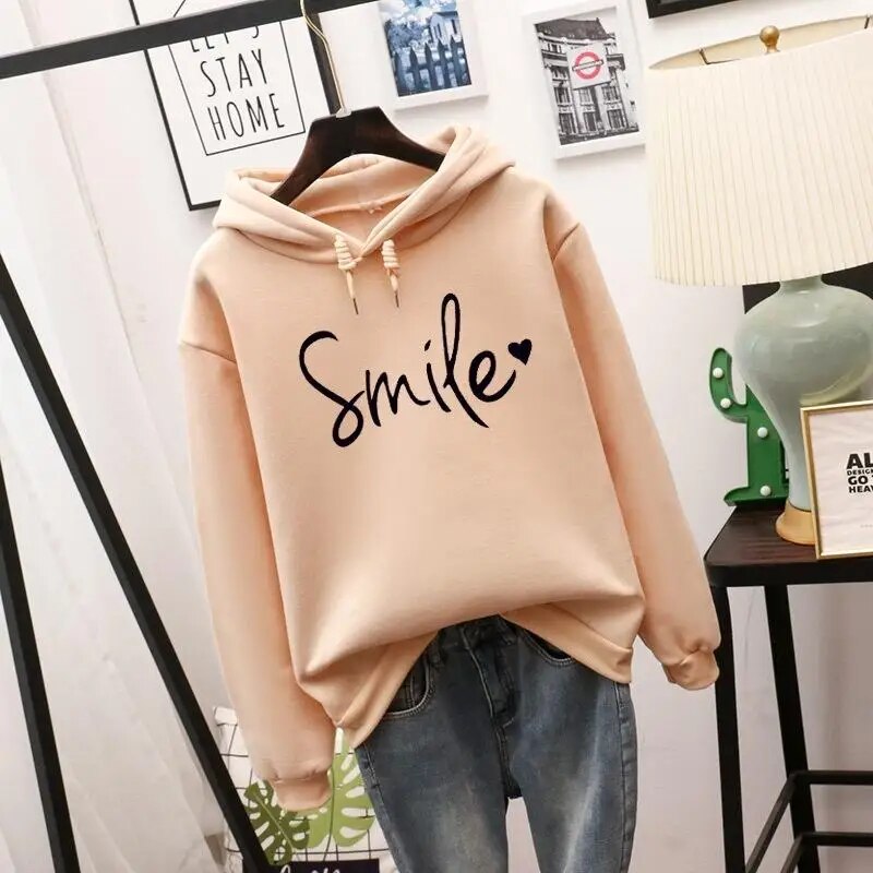 Harlow oversized Smile graphic hoodie in apricot, front view on hanger