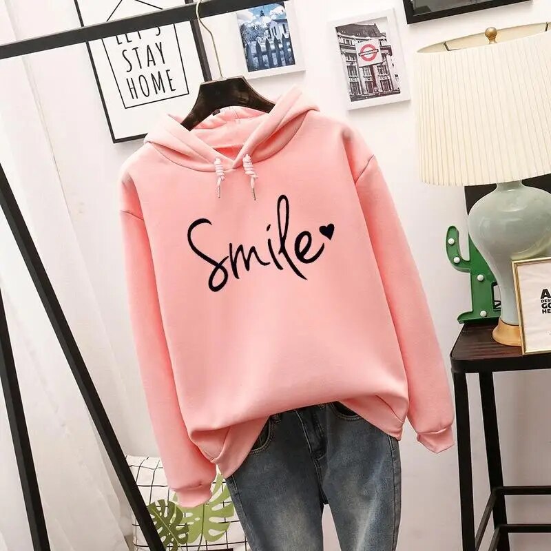 Harlow oversized Smile graphic hoodie in pink, front view on hanger
