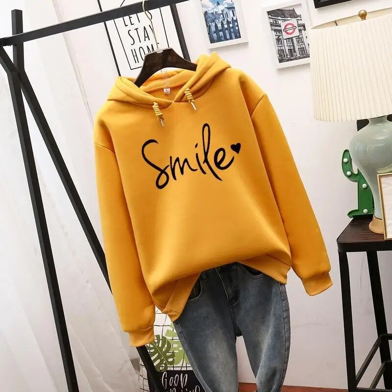 Harlow oversized Smile graphic hoodie in yellow, front view on hanger