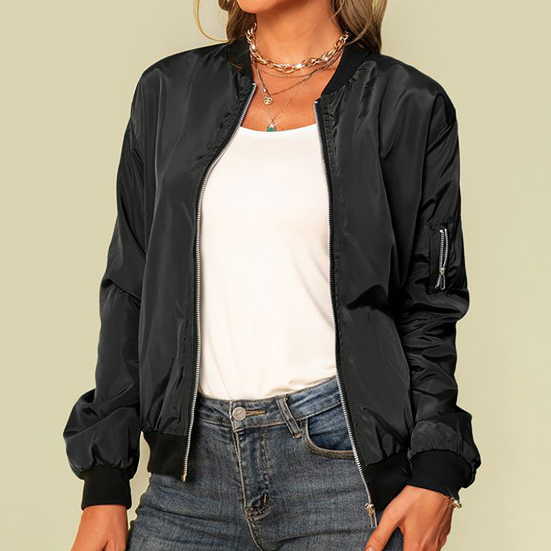 Harlow casual zip-up bomber jacket in black, front view styled with jeans