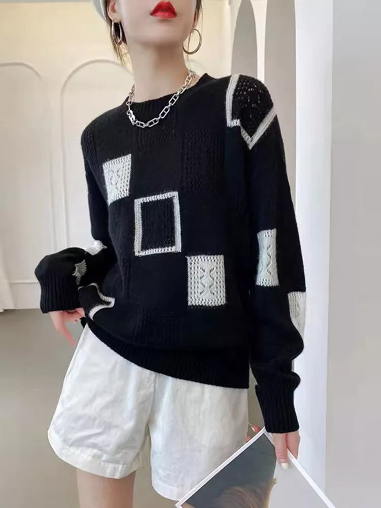 Harlow oversized patchwork crew neck sweater in black, front view