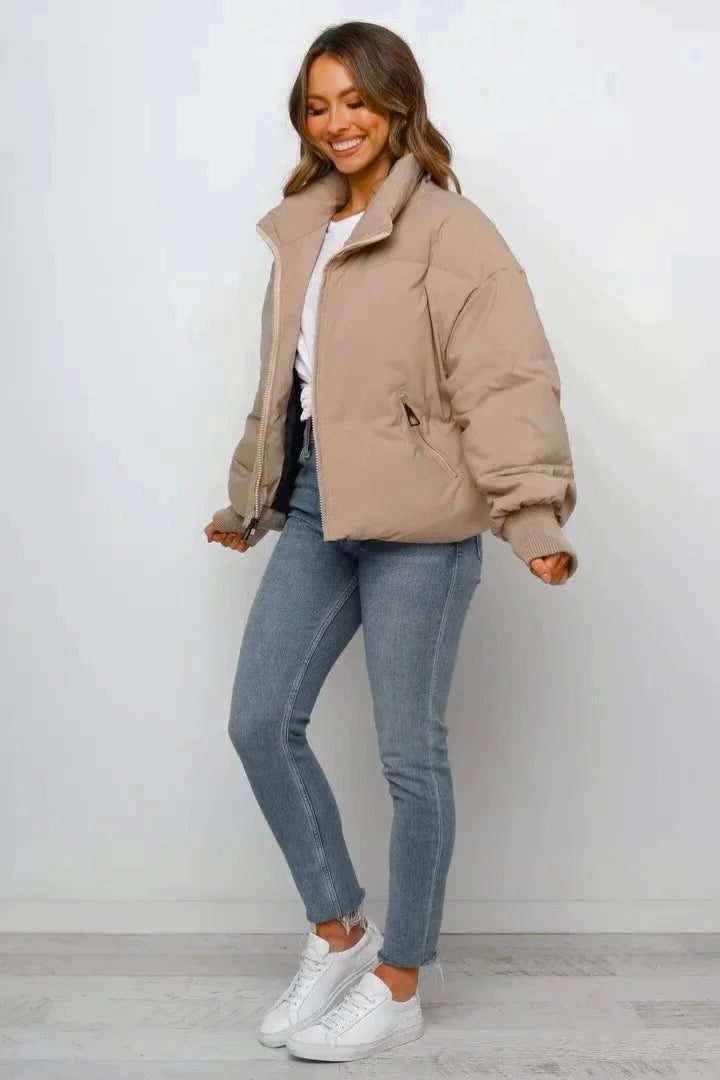 Harlow puffer jacket, side view styled with jeans