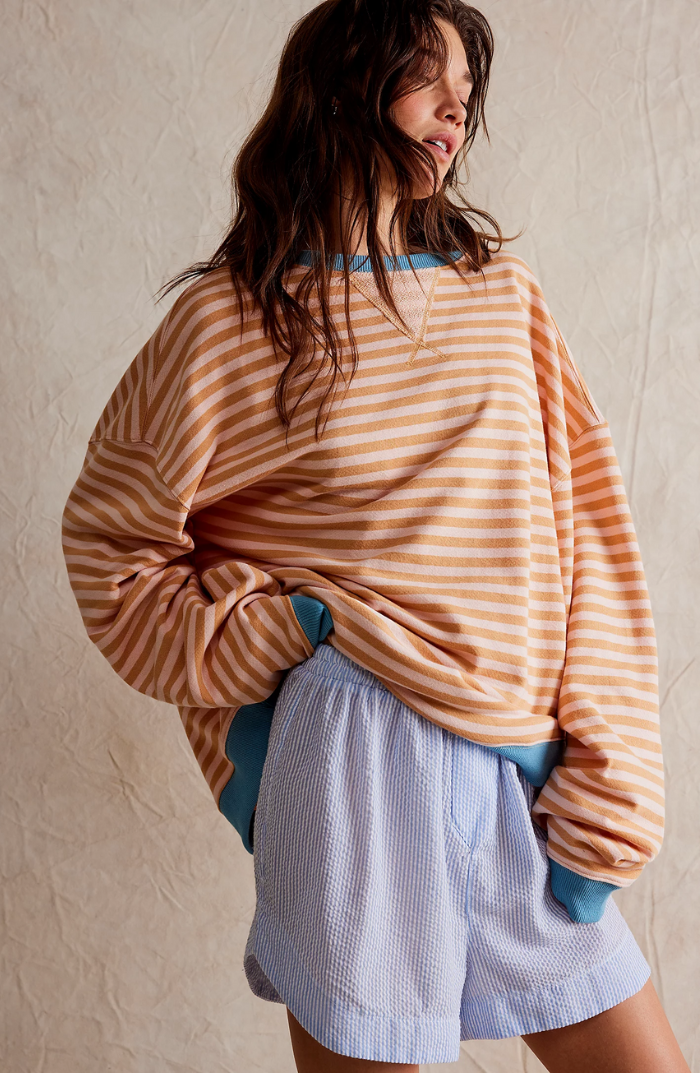 Harlow striped oversized sweatshirt in orange, side back view with contrast ribbed trim