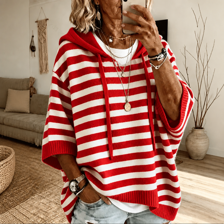 Harlowe oversized hooded sweater in pink stripe, walking pose