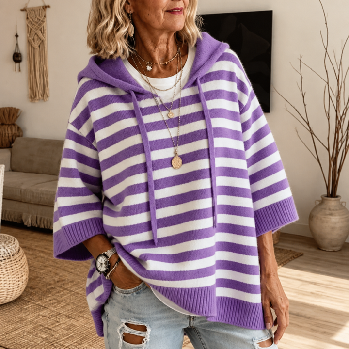 Harlowe oversized hooded sweater in pink stripe, walking pose