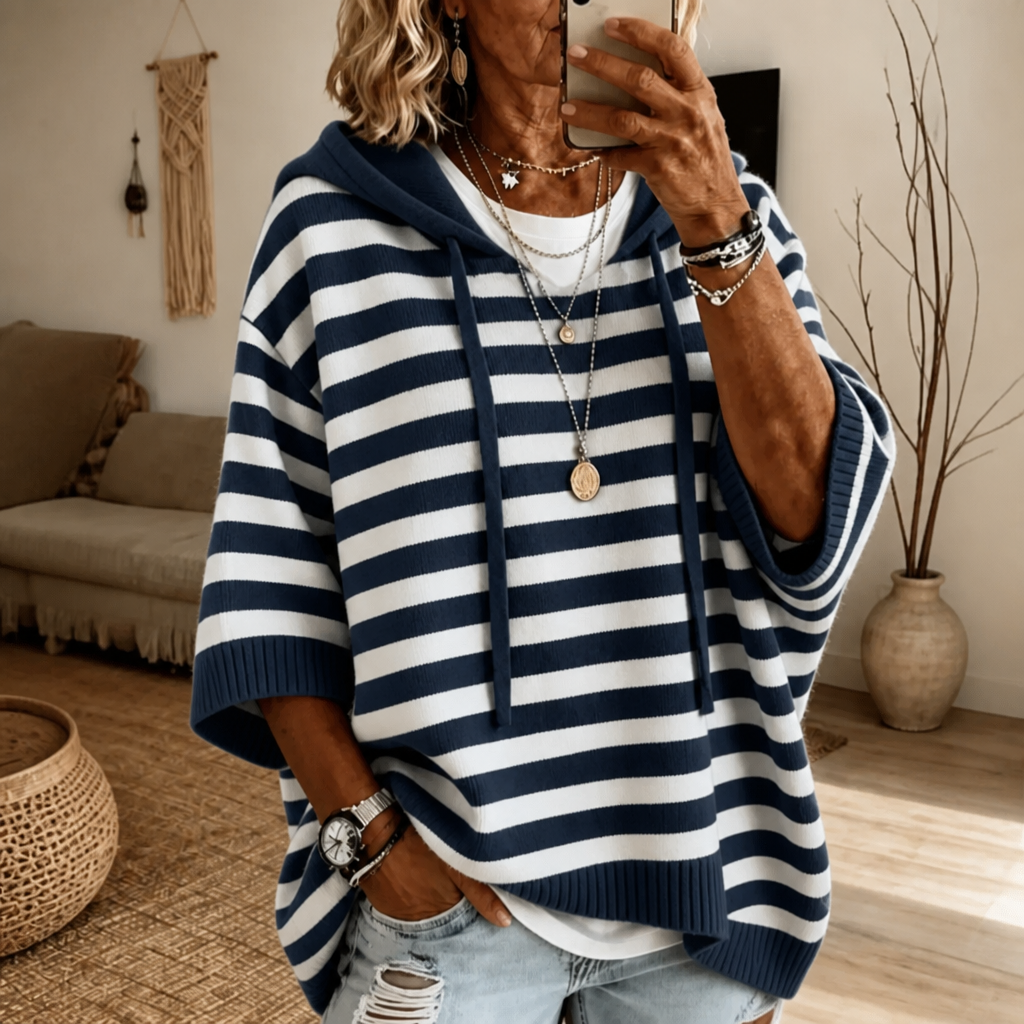 Harlowe oversized hooded sweater in pink stripe, walking pose