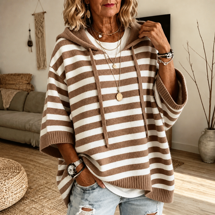 Harlowe oversized hooded sweater in pink stripe, walking pose