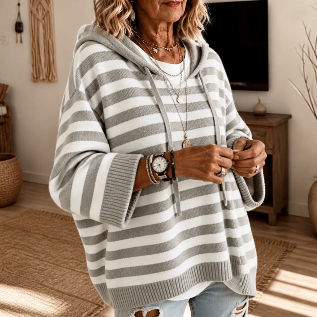 Harlowe oversized hooded sweater in pink stripe, walking pose